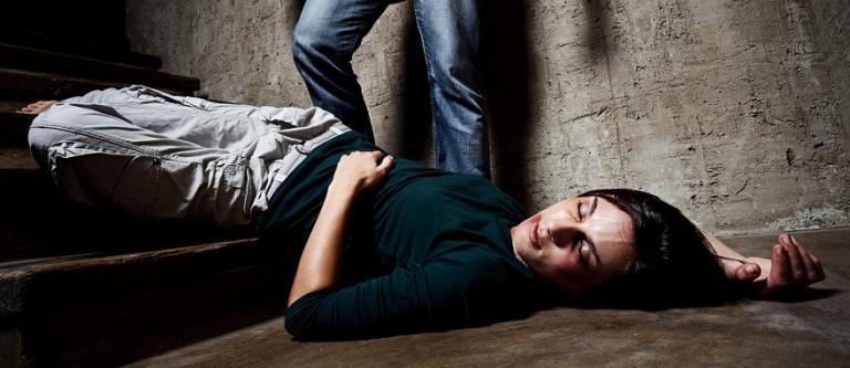 Battered,Woman,Lies,Lifelessly,At,The,Bottom,Of,Stairs,With