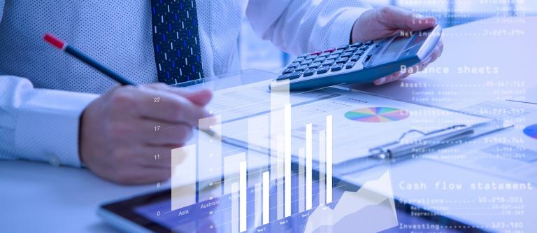 Businessman,Or,Analyst,Holding,Calculator,While,Reviewing,Financial,Statements,For