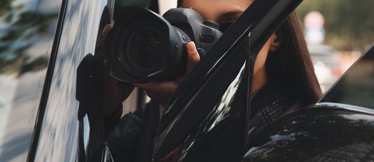 Private,Detective,With,Camera,Spying,Near,Car,Outdoors