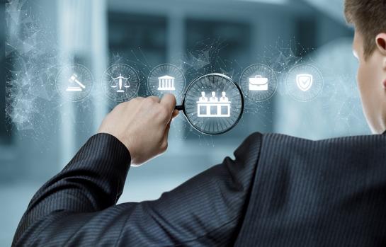 Lawyer,Examining,A,Virtual,Computer,Screen,With,A,Magnifier.