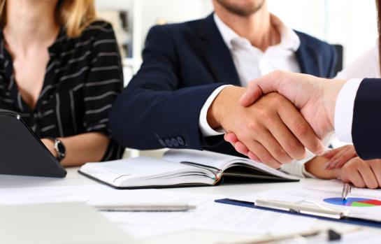 Man,In,Suit,Shake,Hand,As,Hello,In,Office,Closeup.