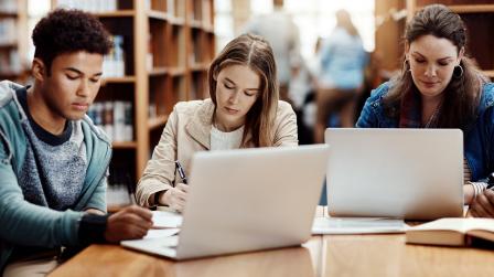 Laptop,,Research,And,Students,Learning,At,College,Library,For,Education,