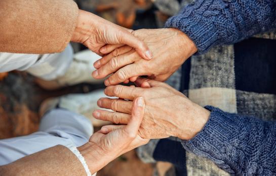 Cropped,Photo,Of,A,Mature,Couple,Holding,Hands.,Hand,In