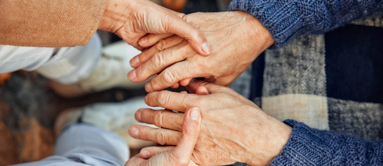 Cropped,Photo,Of,A,Mature,Couple,Holding,Hands.,Hand,In