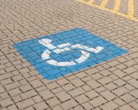 Horizontal,Photo,Of,A,Blue,Handicap,Parking,Sign,Painted,On