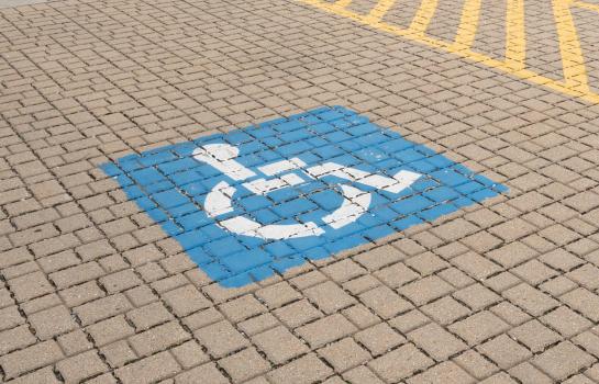 Horizontal,Photo,Of,A,Blue,Handicap,Parking,Sign,Painted,On