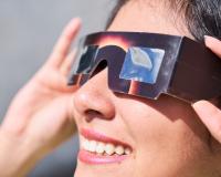 Smiling,Young,Latin,Woman,Watching,An,Eclipse,Of,The,Sun