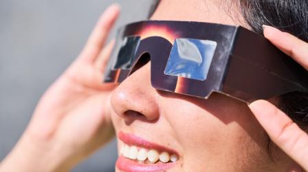 Smiling,Young,Latin,Woman,Watching,An,Eclipse,Of,The,Sun