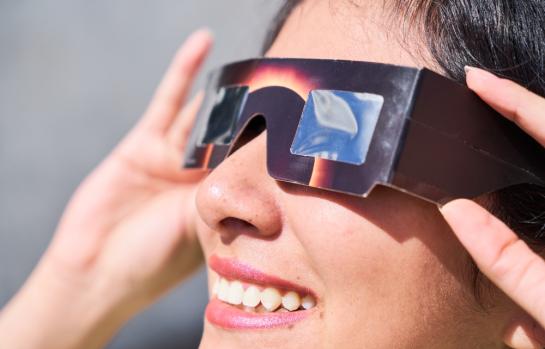 Smiling,Young,Latin,Woman,Watching,An,Eclipse,Of,The,Sun