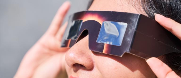 Smiling,Young,Latin,Woman,Watching,An,Eclipse,Of,The,Sun